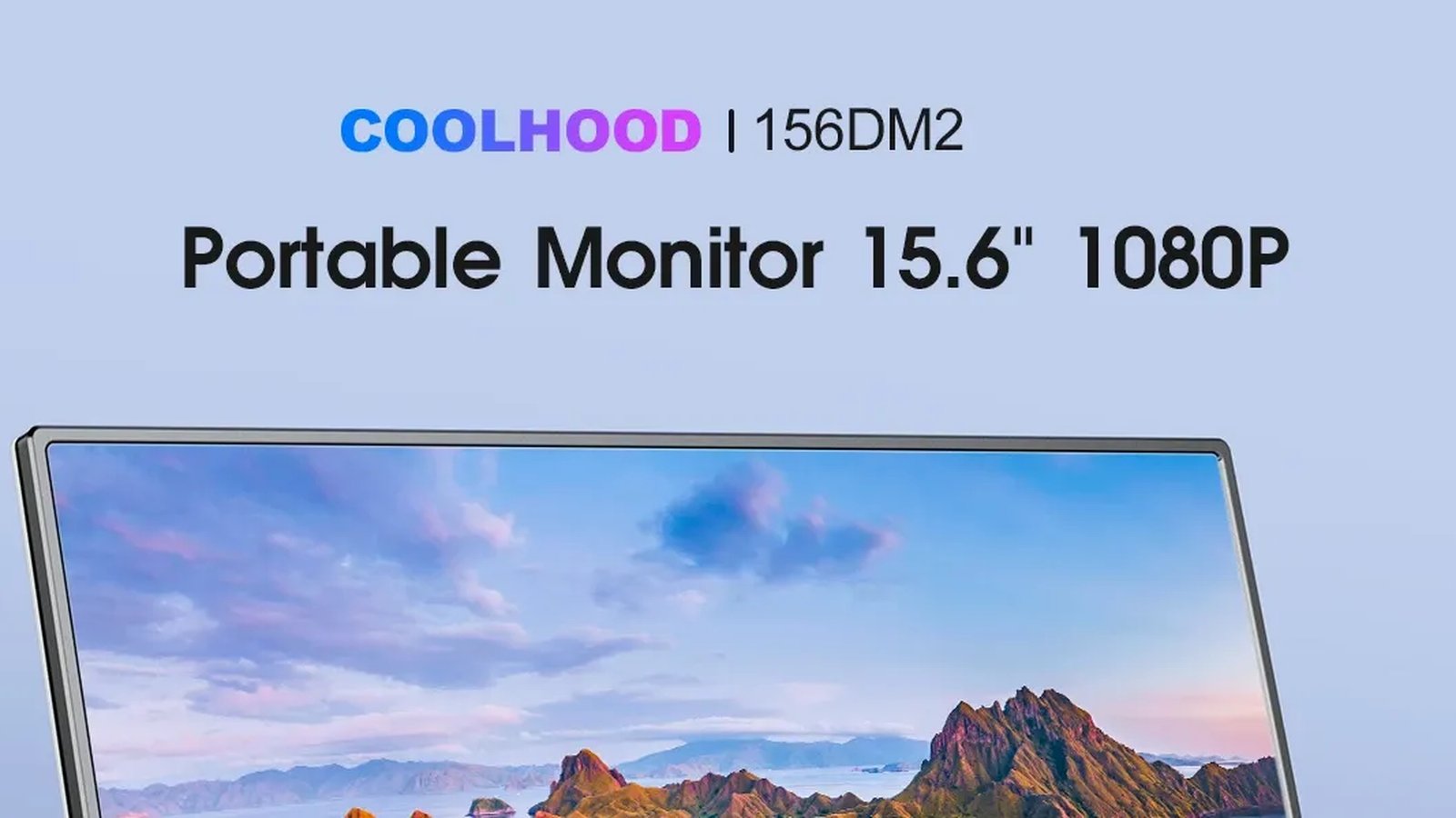 Coolhood 15.6in portable USB-C monitor beside a laptop, set up for a Coolhood vs ARZOPA comparison on a UK desk.